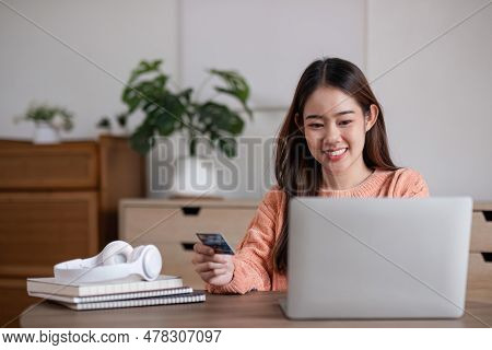 Image Of Young Asian Woman Order Online, Shopping From Home. Girl Enter Credit Card Info On Webside 