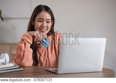 Image Of Young Asian Woman Order Online, Shopping From Home. Girl Enter Credit Card Info On Webside 
