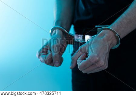 Young Man Desperate To Catch The Iron Prison, Prisoner Concept, Handcuffed Hands Of A Prisoner In Pr