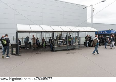 London, England - September 29, 2017: Luton Airport Smoking Area. London, England, United Kingdom.