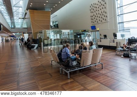 Copenhagen, Denmark - August 24, 2017: Copenhagen International Airport Kastrup. People Sitting On T