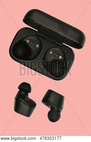 Wireless Stereo Earbuds. Black Wireless Earphones And Charging Case. Earbuds Or Headphones And Charg