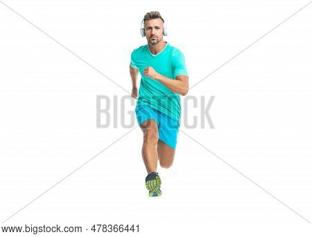 Confident Sport Jogger Listen To Music In Headphones. The Jogger Ran At Sport Training Isolated On W