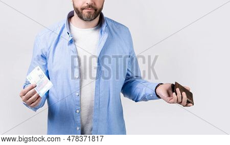 Cropped View Of Moneyless Man With Wallet At Hand. Photo Of Moneyless Man With Wallet.