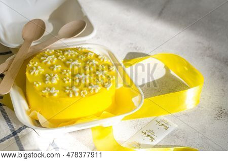 Trendy Bento Cake Yellow Color With Cute Decor On Light Background. Cake Into Tne Sun Light. Cake Fo