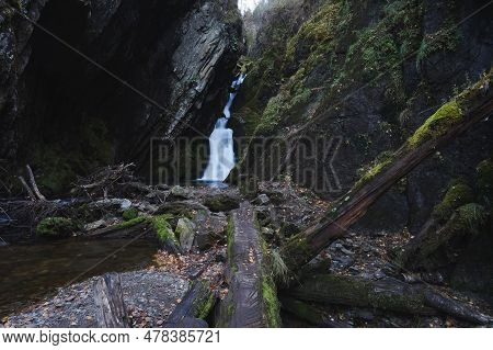 Waterfall In The Rocks In The Forest. Estyuba Waterfall On Lake Teletskoye, Altai, Russia.