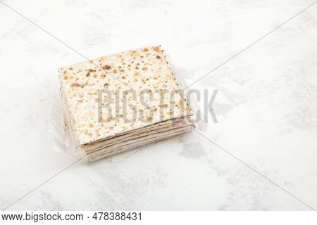 Matzah Or Matzo Kosher Food For Passover, Made From Flour And Water. Unleavened Flatbread. Jewish Cu