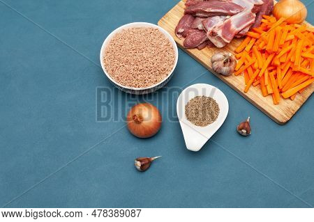 Raw Food, Pilaf. Ingredients For Pilaf, Meat Lamb, Devzira Rice, Cumin, Garlic And Carrots On Wooden