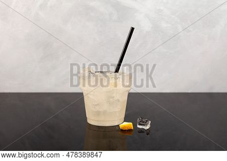 Pomada Iced Drink In Disposable Plastic Take Away Cup. Iced Cocktail With Gin And Lemonade. Refreshi
