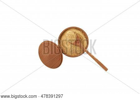 Fenugreek Flour Or Hulbah Powder In Wooden Bowl On White Background, Top View. Selective Focus. Herb