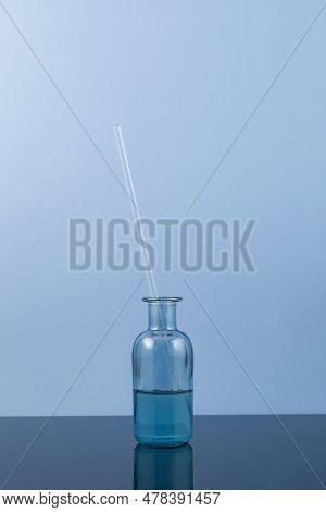 Glycerin In A Blue Glass Bottle. Laboratory Tableware With Viscous Dense Liquid Or Serum For Cosmeti