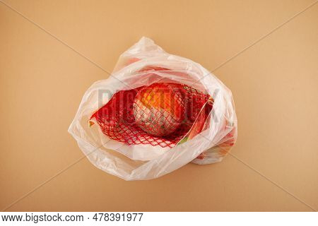 Spoiled Orange Fruit In Plastic Bag. Concept - Improper Storage Of Citrus Fruits. Reduce Organic Foo