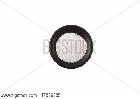 Sodium Benzoate, Sodium Salt Of Benzoic Acid In Black Dish. White Crystalline Powder, Chemical Formu