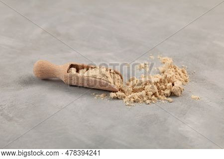 Soy Protein Isolate In Wooden Scoop, Selective Focus. Pure Powder Isolated From Soybean Used In Food