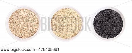 Black And White Sesame Seeds, Benne In White Bowls. Unhulled And Hulled White, And Unhulled Black Se