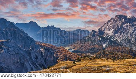 Stunning Alpine Landscape At Sautumn Sunny Day. Alpine Meadow And Road, Mountains On Background. Ama