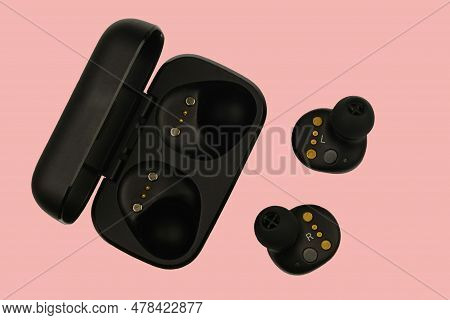Wireless Stereo Earbuds. Black Wireless Earphones And Charging Case. Earbuds Or Headphones And Charg