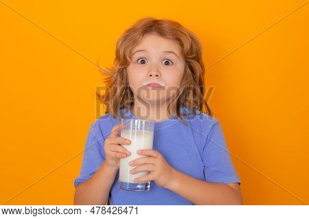 Organic Milk. Studio Isolated Portrait Of Child Drinking Milk. Kid With Glass Of Milk And Milk Moust
