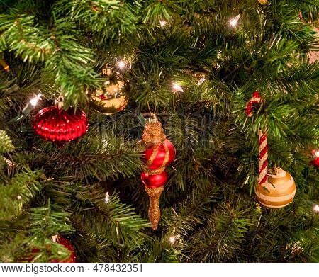 Halo Of Electtric Lights And Color Balls Decorating Artificial Christmas Tree