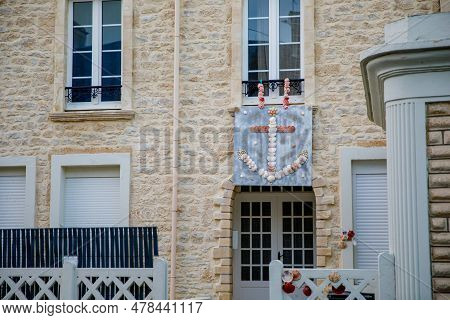 Sunrise View Of Coastal Street Of Grandcamp Maisy, A Scenic French Coastal Town In Normandy, With Fi