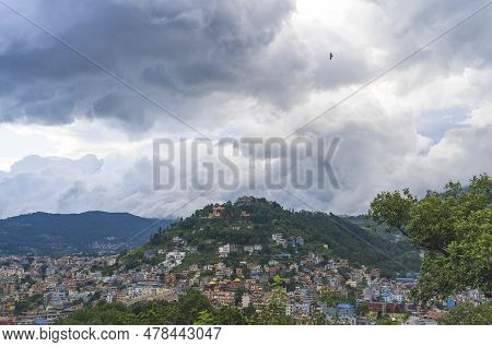 City View Of Kathmandu, Nepal. Colorful Buildings Against The Backdrop Of Mountains