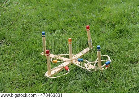 A Vintage Wooden Game Of Hoopla With Rope Hoops.