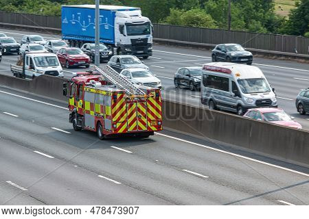 London, Uk - June 14, 2023: Fire Engine Travelling On Busy British Motorway M25