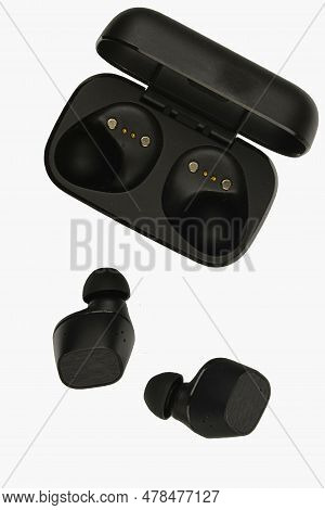 Wireless Stereo Earbuds. Black Wireless Earphones And Charging Case. Earbuds Or Headphones And Charg