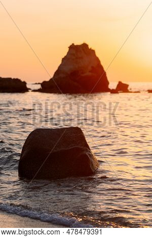 Beautiful View Of Orange Sunset Seascape With Rocks In Italy. Tropical Colourful Sunrise Landscape. 