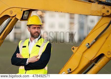Construction Business Owner. Man In Suit And Hardhat Halmet At Building Construction Site. Civil Eng