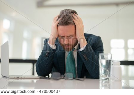 Head Pain Concept. Cephalalgia And Migraine. Man With Sinus Headache, Tension Or Cluster Headache. H