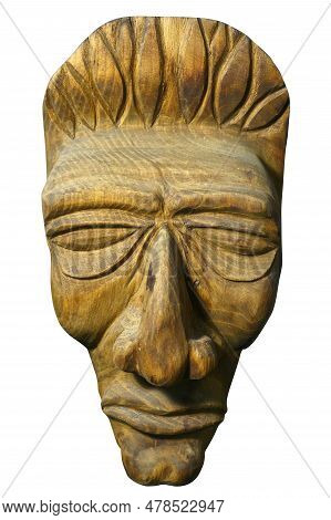 Mask Of Human Face Is Carved Out Of Wood. Antique Religious Totem Of Natives Or People Of Ancient Tr