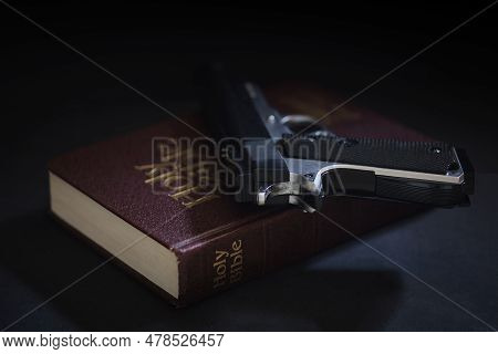 Bible And A Gun On It. Can Be Used To Symbolize Freedom, Conservatism Or Gun Rights.