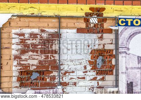 Torn Holes In A Brick Wall After Shelling From A Gun By The Russians During The Occupation Of Trosty
