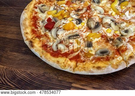 Funghi Pizza With Tomato Sauce, Cheese, Mushrooms, Peppers And Corn On Wooden Table