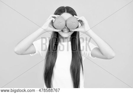 Funny Teenager Portrait. Happy Teenager Girl Hold Grapefruit Orangeisolated On Yellow Background, Ki