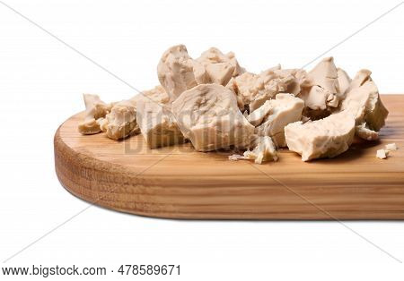 Pieces Of Compressed Yeast Isolated On White