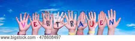 Children Hands Building Word Vertrauen Means Trust, Blue Sky