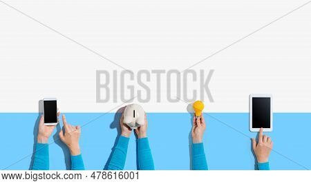 Technology Devices And A Piggy Bank From Above