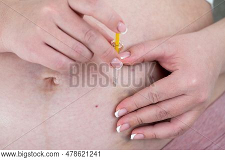 Blood Thinners Concept. Close Up Of Pregnant Woman Making Injection In Stomach