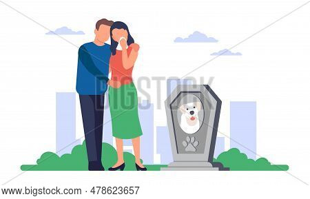 Sad Young Male And Female Couple Standing Near Grave Of Their Dog In Cemetery. People Mourn Dead Pup