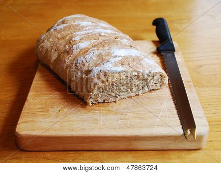 Sourdough On Chopping Board With Knife