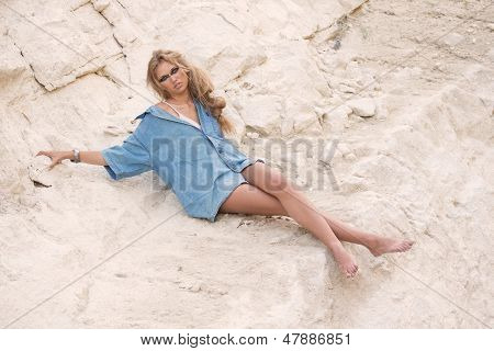 Girl In Oversize T-shirt Over Stone-pit Background