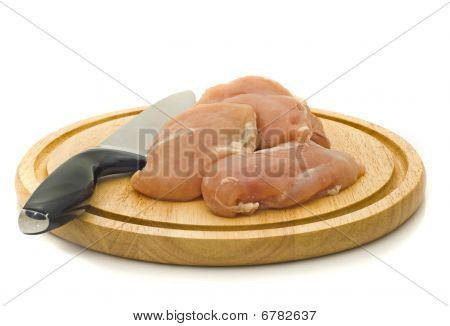 เนื้อไก่และมีดบน Hardboard