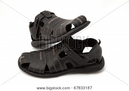 Black sandals on white