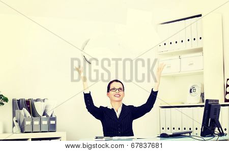 Business woman is trowing documents, in office.