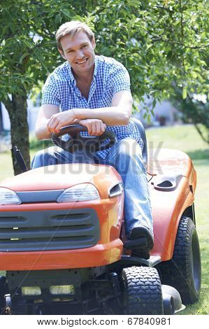 Man Cutting Grass Using Sit On Mower