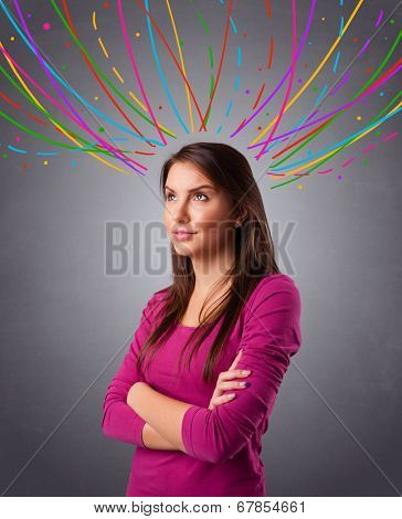 Pretty young girl thinking with colorful abstract lines overhead
