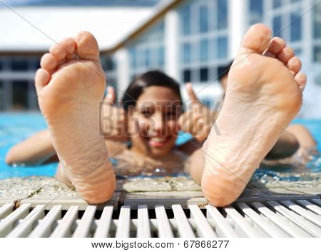 Happy little boys enjoying relaxing and splashing in water