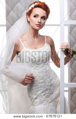 A photo of sexual beautiful bride in a wedding-dress is in fashion style. Wedding decorations